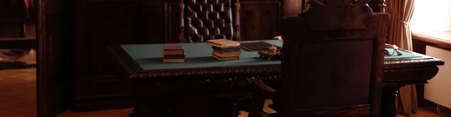 Historic office desk with open files and document binders
